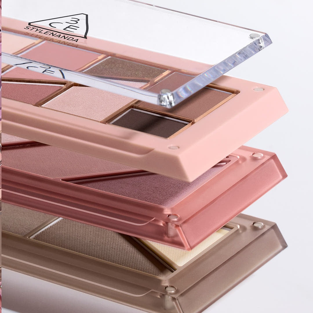 Close-up of the 3CE Layer It All Contour Palette 9.5g showcasing its diverse shades in elegant packaging.
