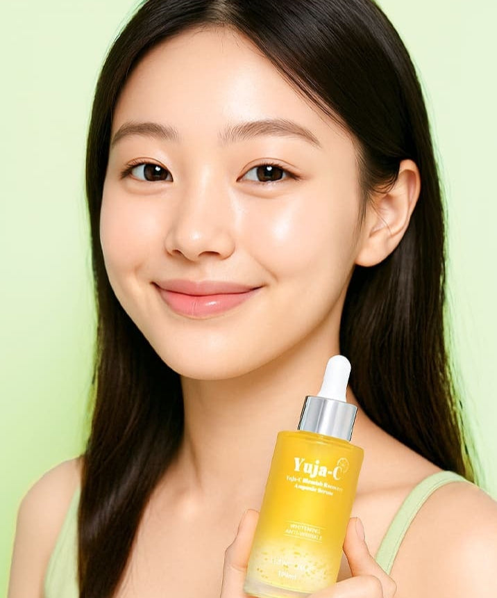 Woman holding 3W CLINIC Yuja C Blemish Recovery Ampoule Serum 100ml bottle