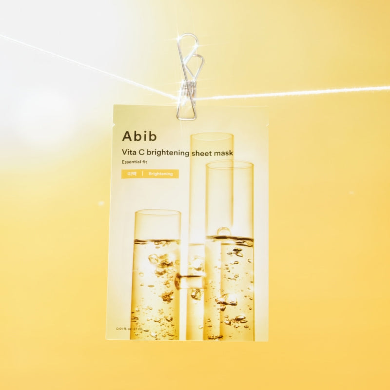ABIB ABIB Madecassoside Soothing Sheet Essential Fit mask packaging on a yellow background.