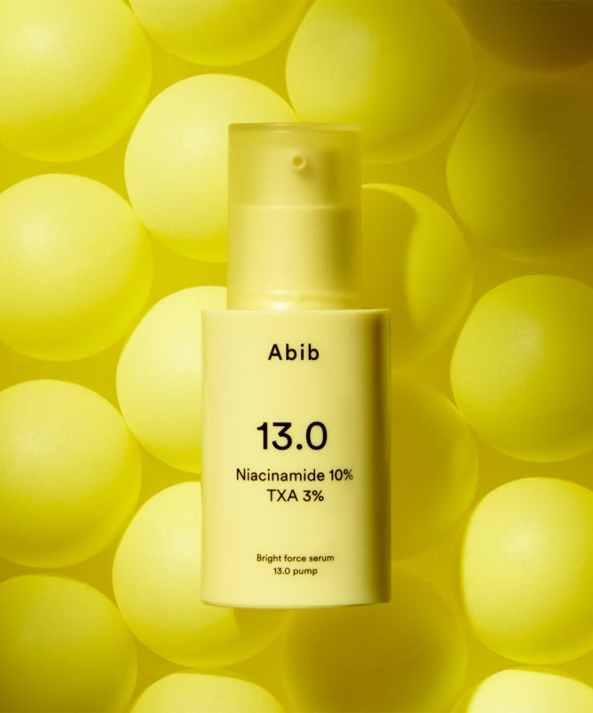 ABIB Bright Force Serum 13.0 Pump 30ml bottle on a yellow background