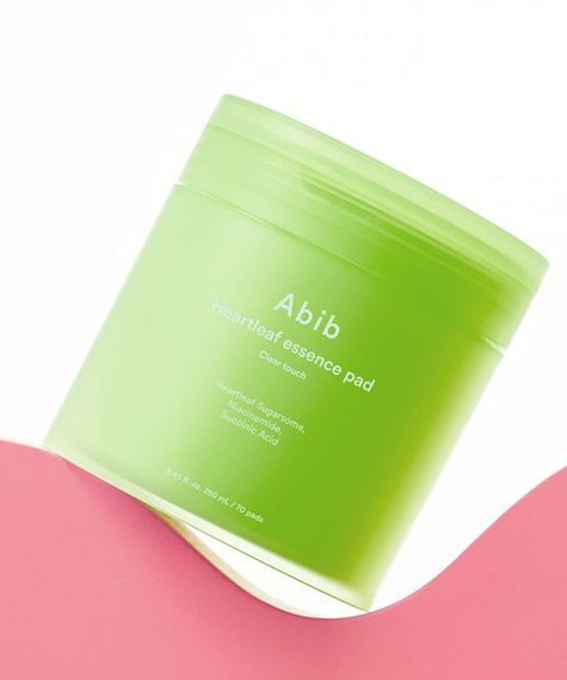 ABIB Eoseongcho Trace Essence Pad Clear Touch 70 Sheets (+70 Sheets Refill + Buckle Pouch) on a pink surface