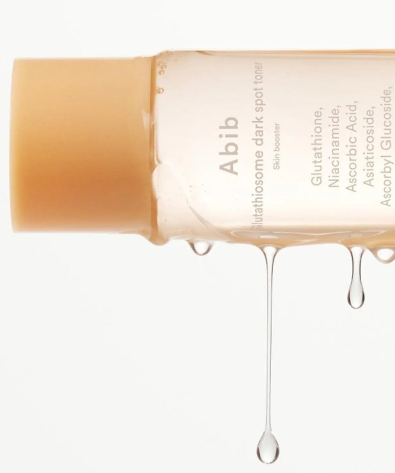 ABIB Glutathiosome Dark Spot Toner Skin Booster 200ml product bottle with liquid dripping.