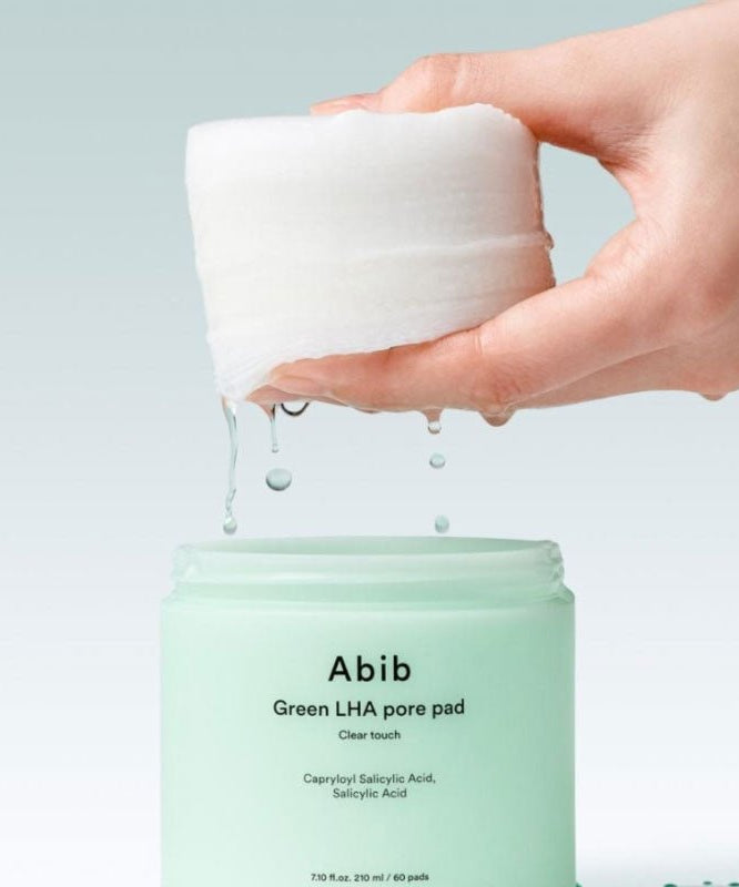 ABIB Green LHA Pore Pad Clear Touch 60 Sheets displayed with opened jar and dripping pad.