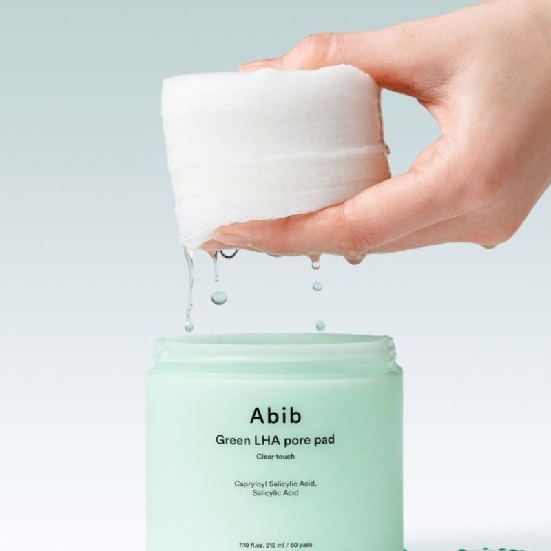 ABIB Green LHA Pore Pad Clear Touch 60 Sheets displayed with opened jar and dripping pad.