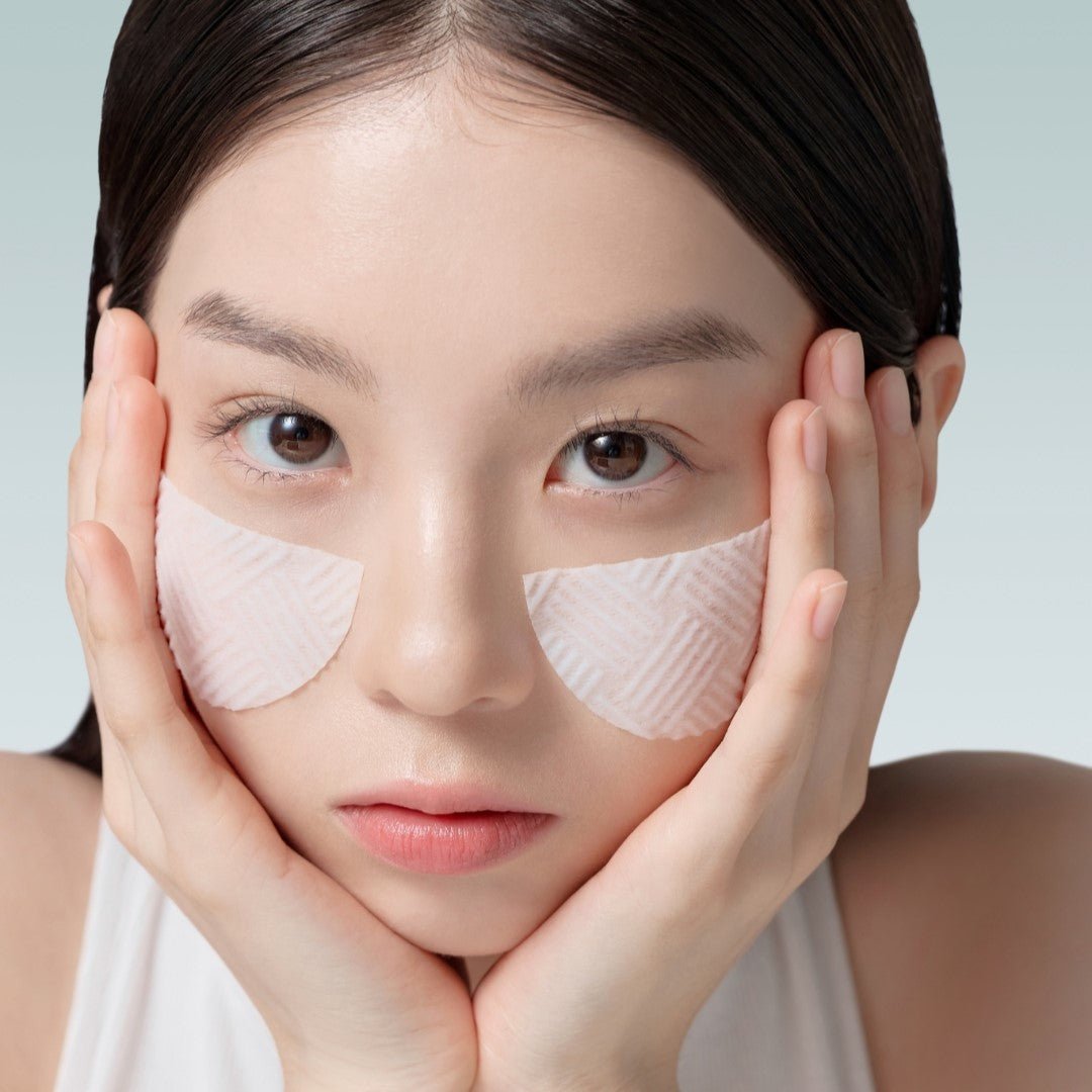 Woman using ABIB Green LHA Pore Pad Clear Touch 60 Sheets on face for skincare.