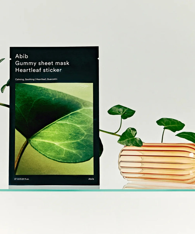 ABIB Gummy Sheet Mask Heartleaf Sticker 10 sheets displayed with greenery and elegant vase