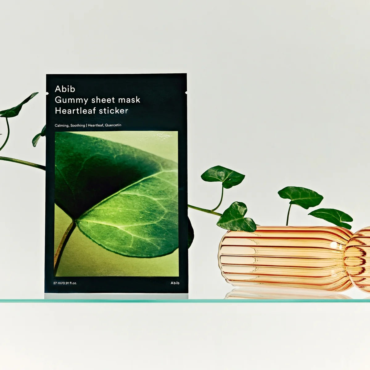 ABIB Gummy Sheet Mask Heartleaf Sticker 10 sheets displayed with greenery and elegant vase