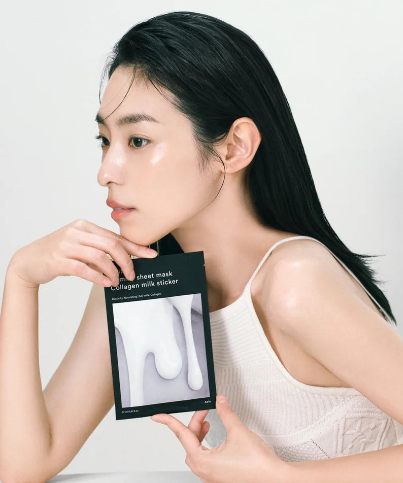 Woman holding ABIB Gummy Sheets Mask Collagen Milk Sticker 10 sheets