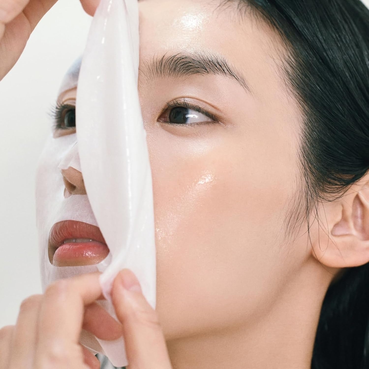 Applying ABIB Gumy Sheet Mask Vita Sticker 10 sheets on face