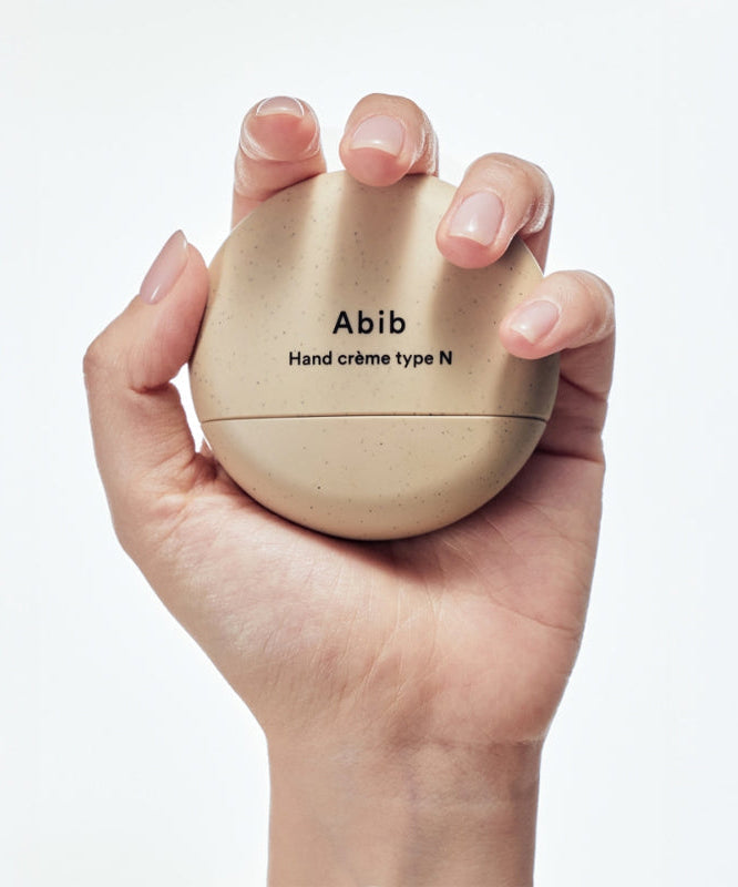 ABIB Hand Cream 3 Types in hand, showcasing compact design and packaging.