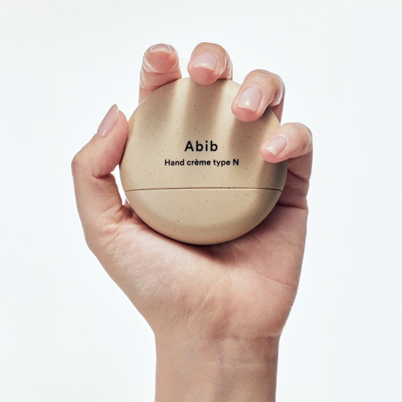 ABIB Hand Cream 3 Types in hand, showcasing compact design and packaging.