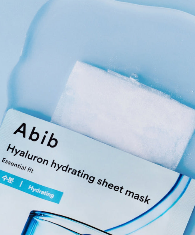 ABIB Hyaluronic Acid Moisture Sheet Mask Essential Fit package on a blue background, showcasing the product design and features.