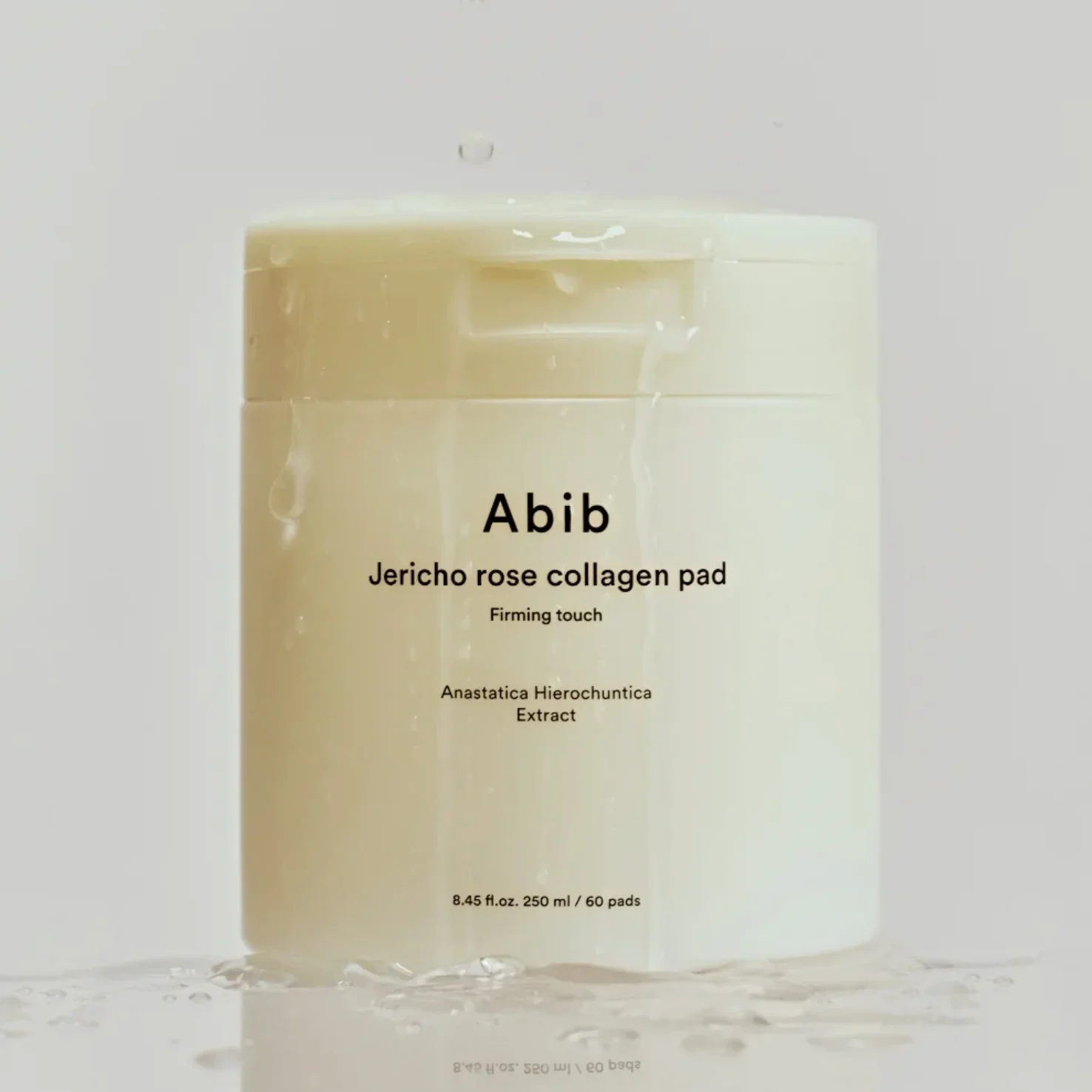 ABIB Jericho Rose Collagen Pad Firming Touch 60 Pads in white container with water droplets