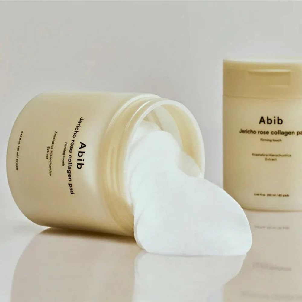 ABIB Jericho Rose Collagen Pad Firming Touch 60 Pads, beauty product with skincare benefits, displayed with open container on a white background.