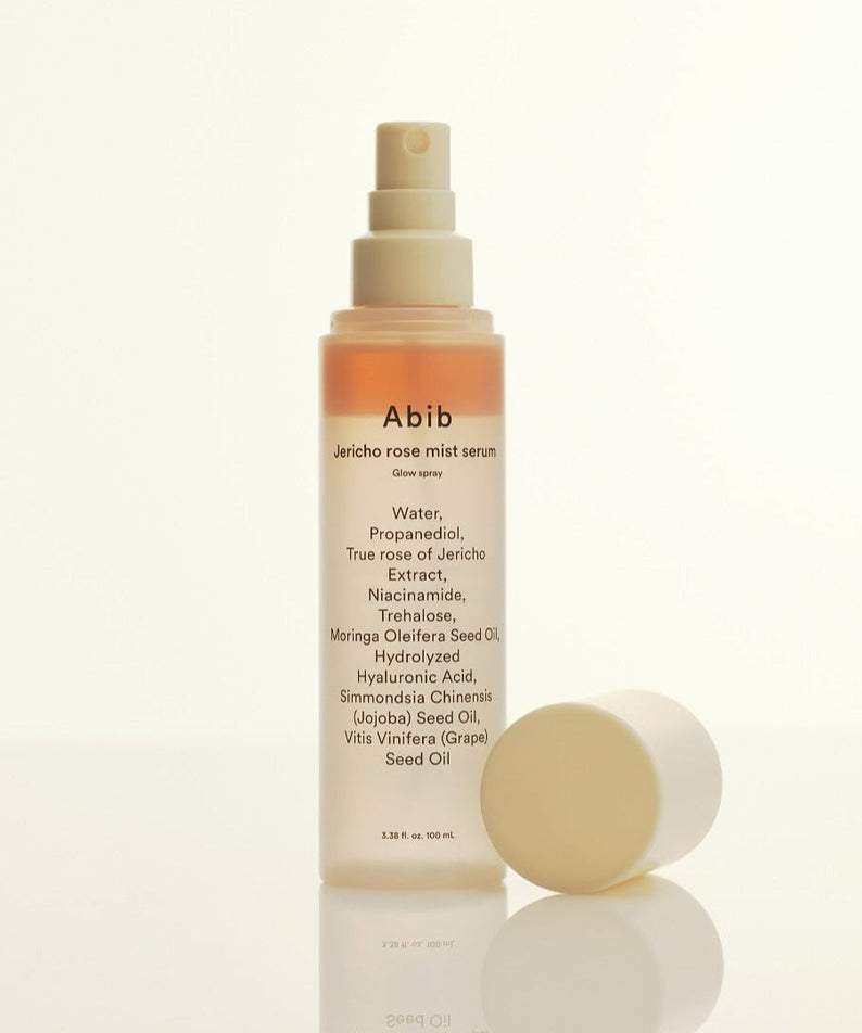 ABIB Jericho Rose Mist Serum Glow Spray 100ml bottle with cap off, showcasing ingredients like niacinamide and hyaluronic acid.