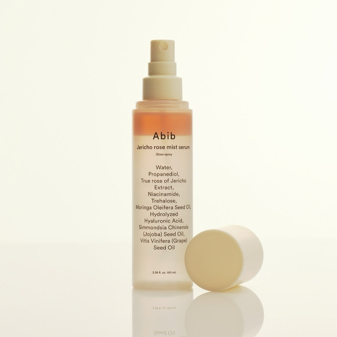 ABIB Jericho Rose Mist Serum Glow Spray 100ml bottle with cap off, showcasing ingredients like niacinamide and hyaluronic acid.