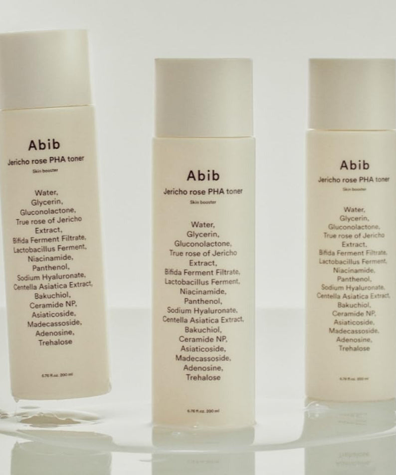 Three bottles of ABIB Jericho Rose PHA Toner Skin Booster 200ml with ingredient list visible on the labels.