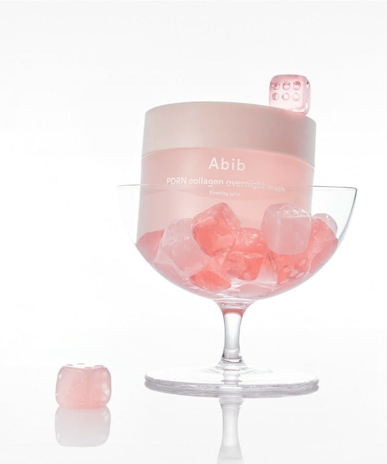 ABIB PDRN Collagen Overnight Mask Firming Jelly 80ml in a glass with pink cubes, showcasing luxurious skincare product.