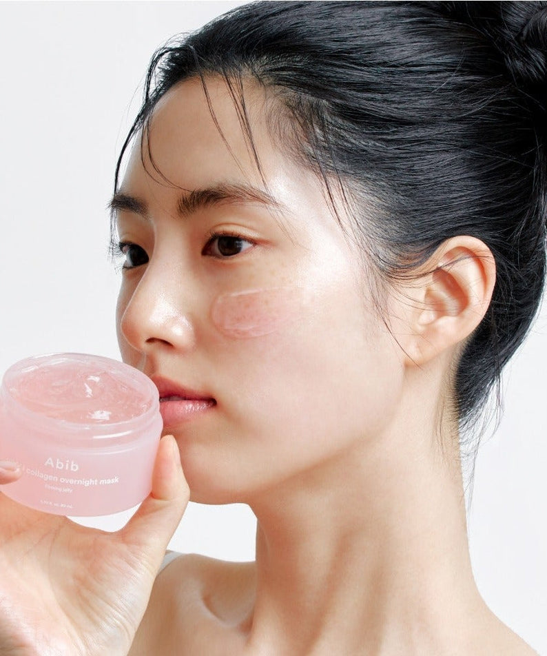 Woman applying ABIB PDRN Collagen Overnight Mask Firming Jelly 80ml to her face, showcasing skincare benefits.