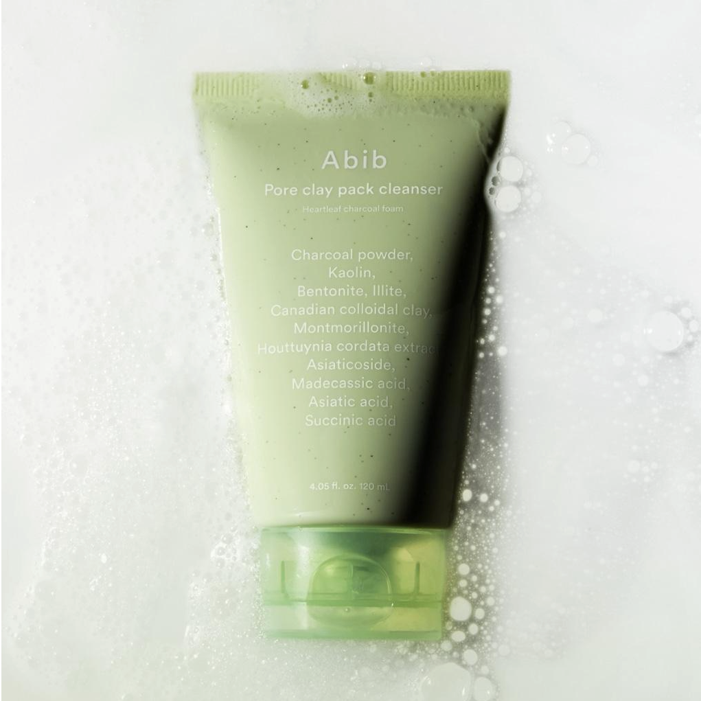 ABIB Pore Clay Pack Cleanser 120ml with ingredients list in a soapy background