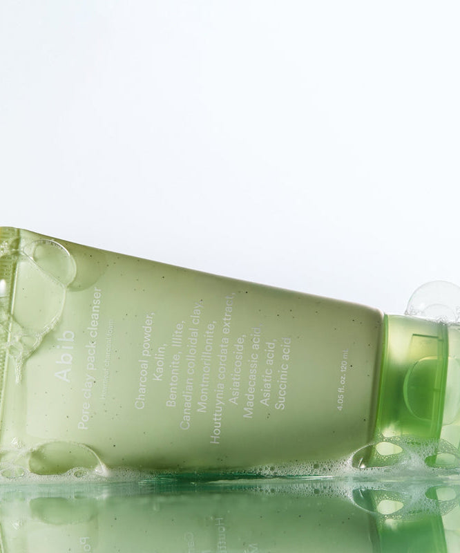 ABIB Pore Clay Pack Cleanser 120ml tube with bubbles on a reflective surface