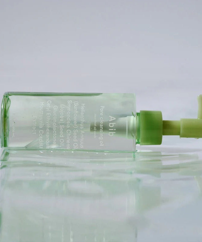ABIB Pore Cleansing Oil Heartleaf Oil-Wash 200ml on reflective surface with green pump