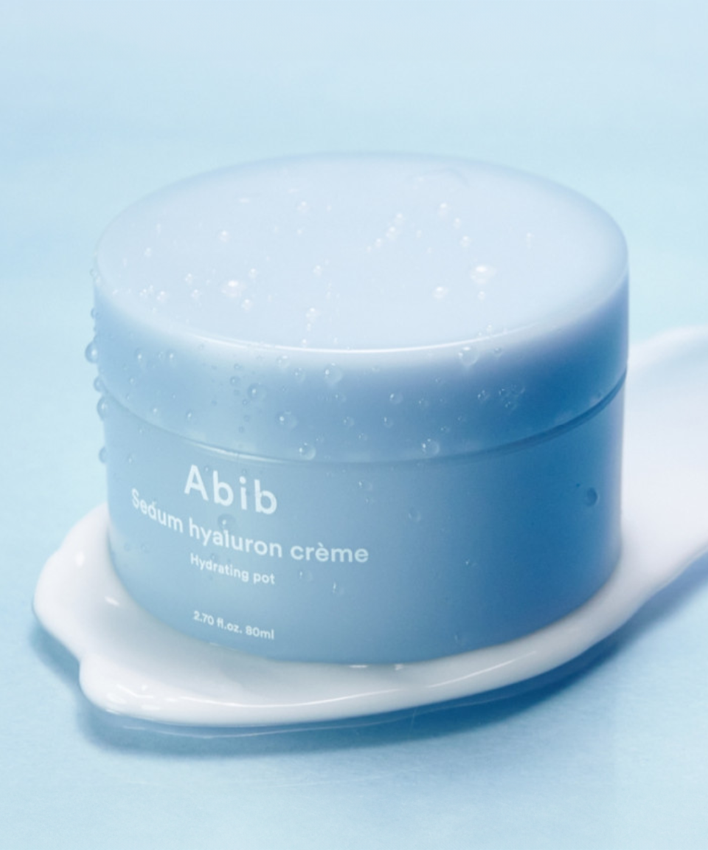 ABIB Sedum Hyaluron Creme Hydrating Pot 80ml product image on a blue background with droplets.