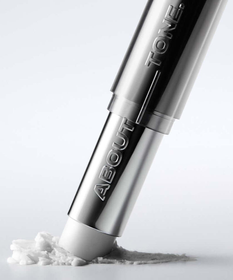 ABOUT TONE Blur Lasting Stick Primer for flawless makeup application, silver packaging with product texture shown.