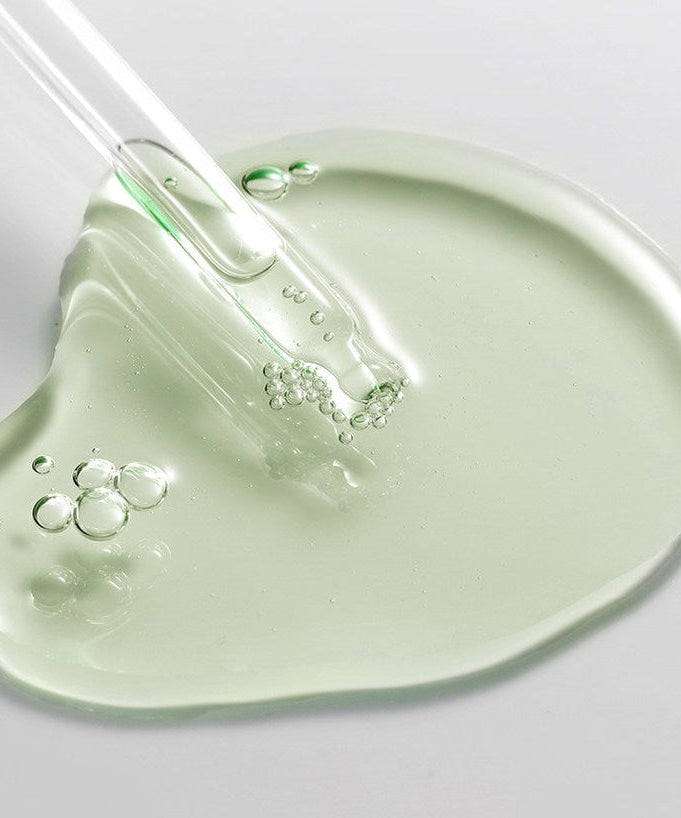 Texture of ACWELL Tea Tree Blemish Control PDRN Ampoule 80ml with glass dropper.
