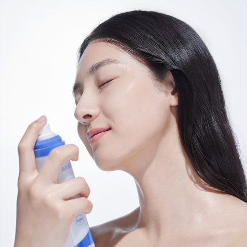 Woman using AESTURA Atobarrier 365 Cream Mist 120ml for skincare