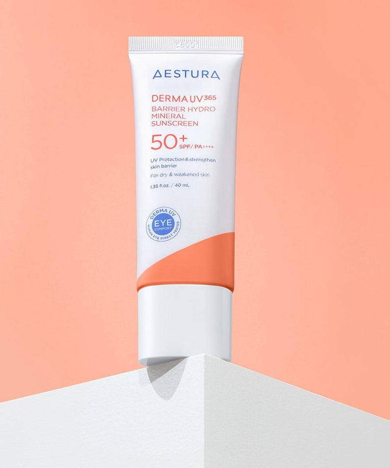 AESTURA Derma UV365 Barrier Hydro Mineral Sunscreen 40ml on display against a peach background showcasing SPF 50+ protection labeling.