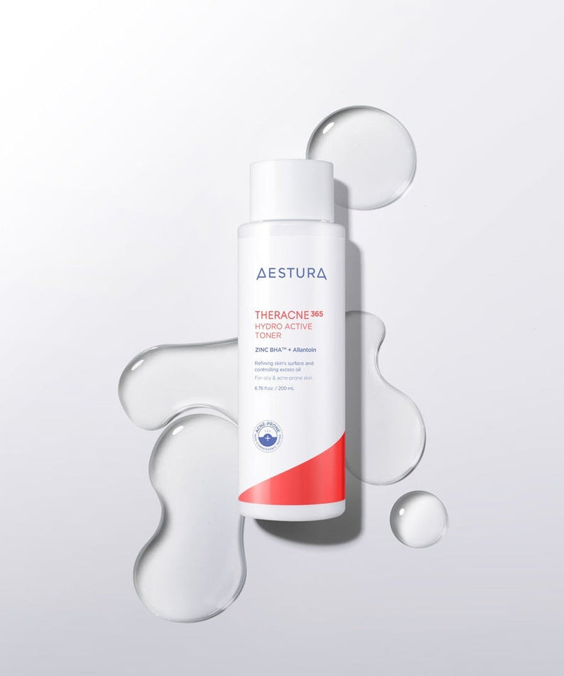 Bottle of AESTURA Theracne 365 Hydro Active Toner 200ml with liquid splashes around on a white background.