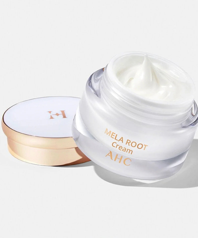 Glass jar of AHC H Mela Root Cream 50ml with a luxurious gold lid, showcasing the creamy texture for skincare enthusiasts.