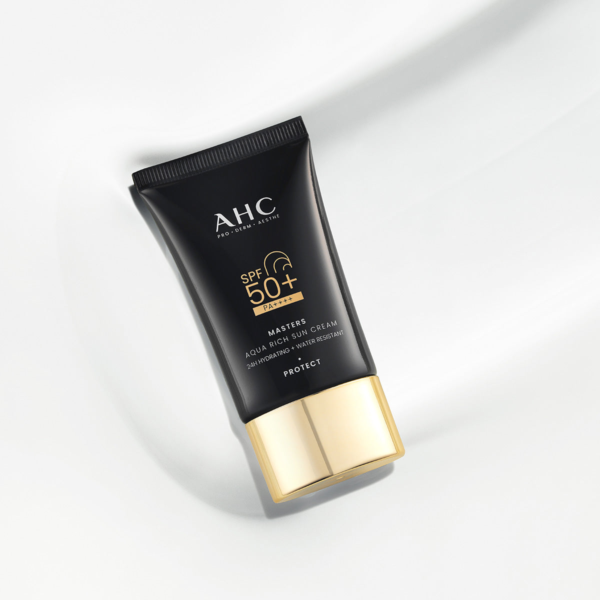 AHC Masters Aqua Rich Sunscreen 50ml tube on a white background showcasing its sleek design and SPF 50+ protection.