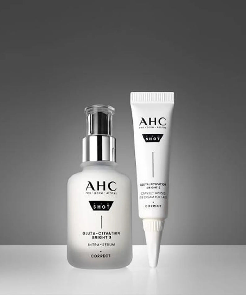 AHC Pro Shot Gluta Activation Bright 3 Intra Serum 40ml bottle and tube on a grey background.
