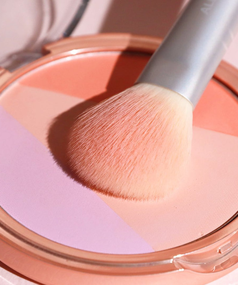 ALL MY THING Aurora Blusher in a compact with a makeup brush on top, showcasing its vibrant shades.