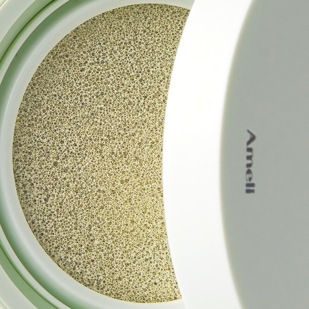 AMELI Complement Series Cushion SPF42 PA++ Green in open compact showcasing cushion texture