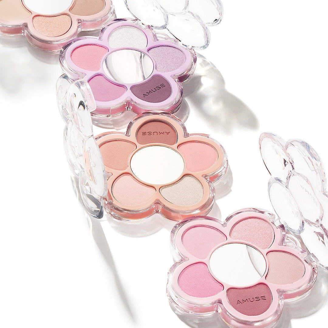AMUSE Flora Eye Palette in flower-shaped packaging with assorted shades, showcasing vibrant and pastel colors.