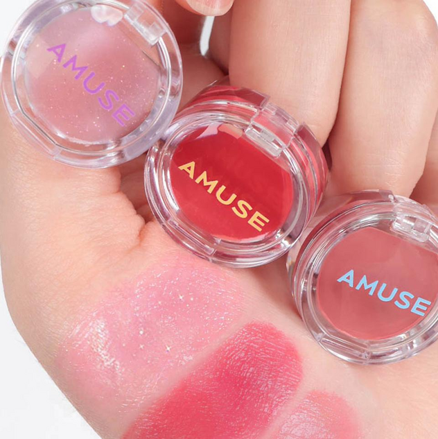 AMUSE Ring Lip Balm Jewelry in three shades displayed on hand