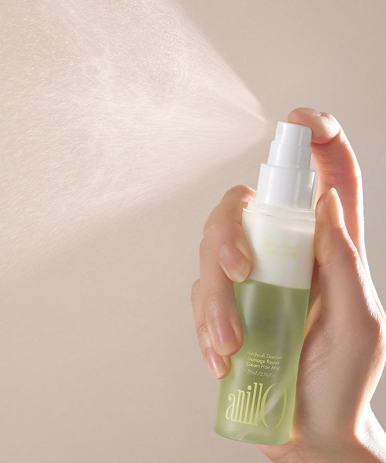 ANILLO Patchouli Garden Damage Repair Cream Hair Mist 70ml being sprayed