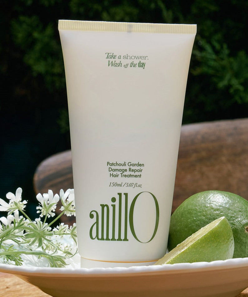 ANILLO Patchouli Garden Damage Repair Hair Treatment 150ml displayed with lime and flowers