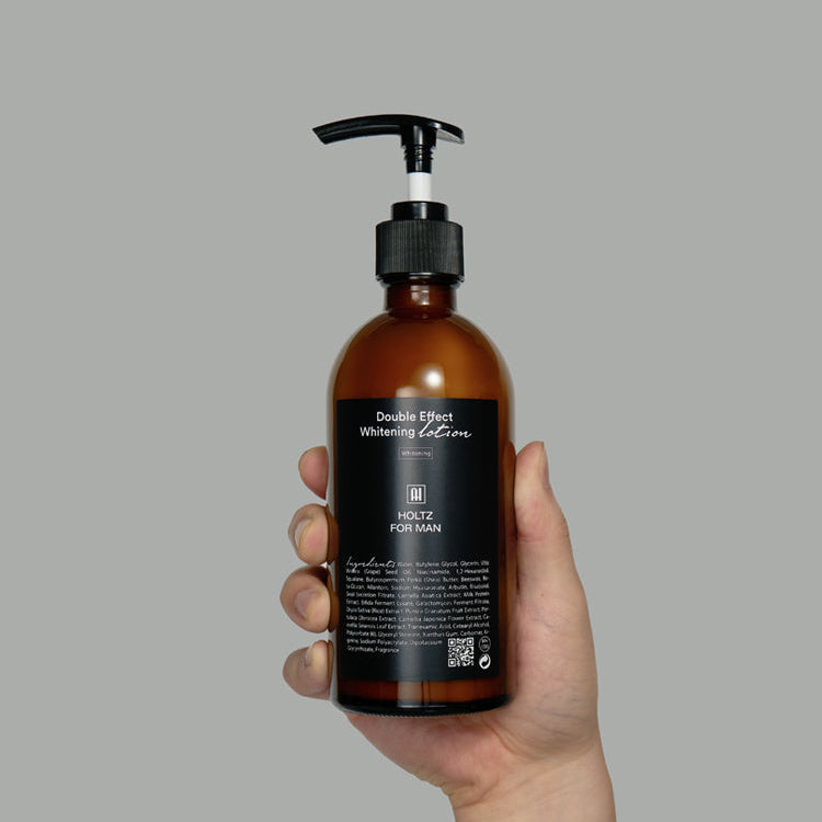 ANNA HOLTZ For Men Double Effect Whitening Emulsion 300ml held by hand, brown pump bottle, Gentleman Korea premium Korean men’s skincare