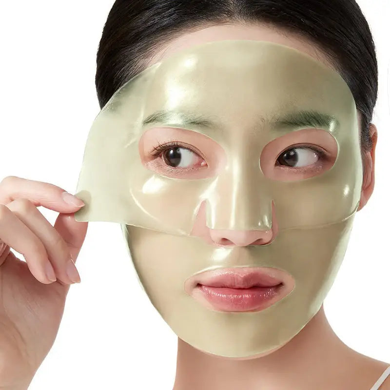 Woman applying ANUA Heartleaf 70 Soothing Collagen Mask 4pcs for skincare treatment