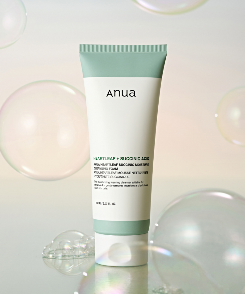 ANUA Heartleaf + Succinic Acid Moisture Cleansing Foam 150ml with bubbles in the background.