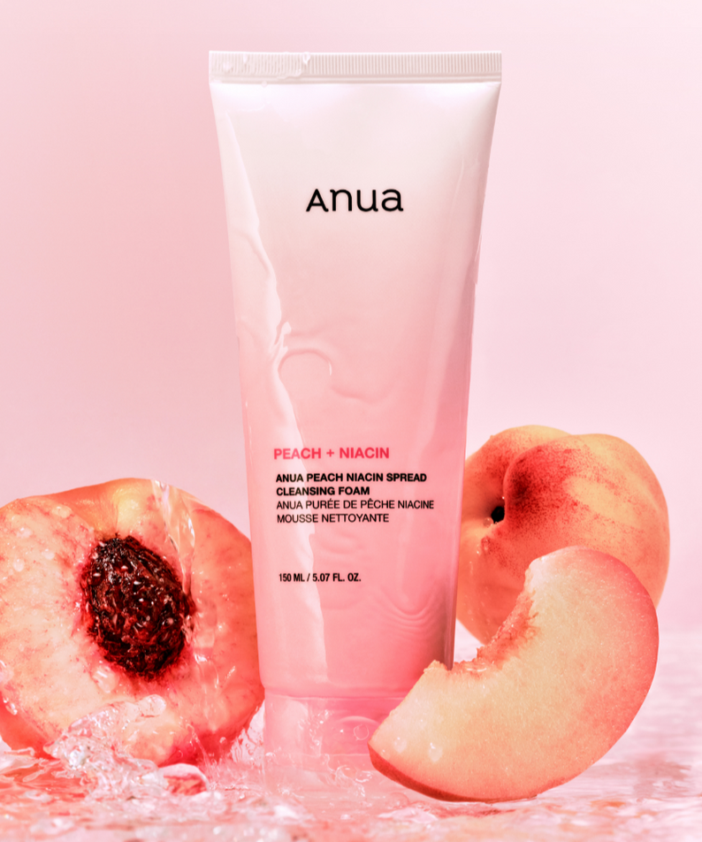 ANUA Peach Niacin Spread Cleansing Foam 150ml with fresh peaches in background