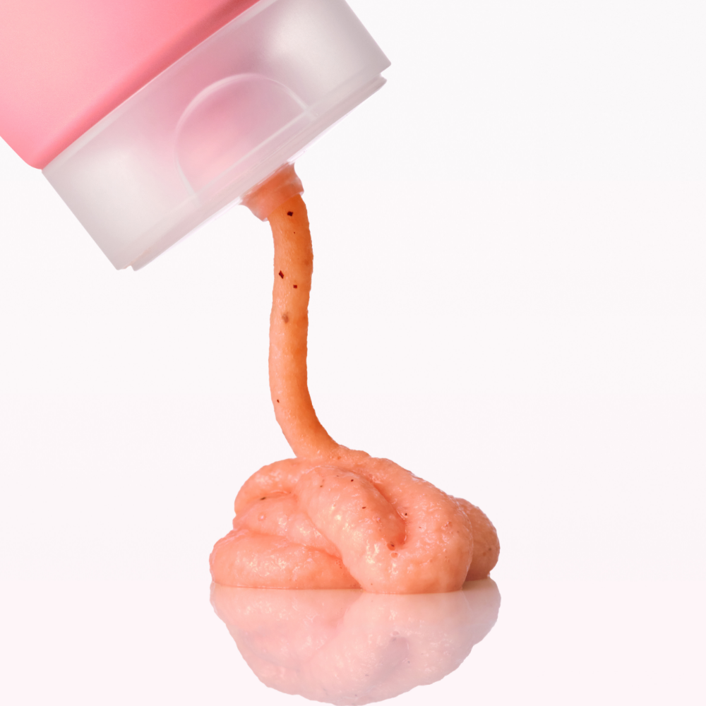 ANUA Peach Niacin Spread Cleansing Foam 150ml being dispensed from tube
