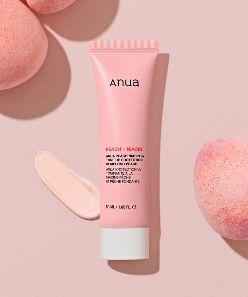 ANUA Peach + Niacin UV Tone Up Protection 50ml sunscreen tube on pink background with peach.