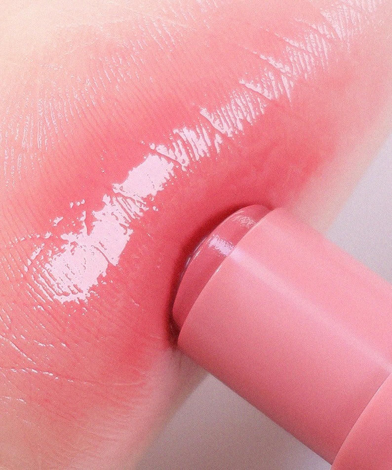 AOU Dewy Bar applied to lips for a glossy finish