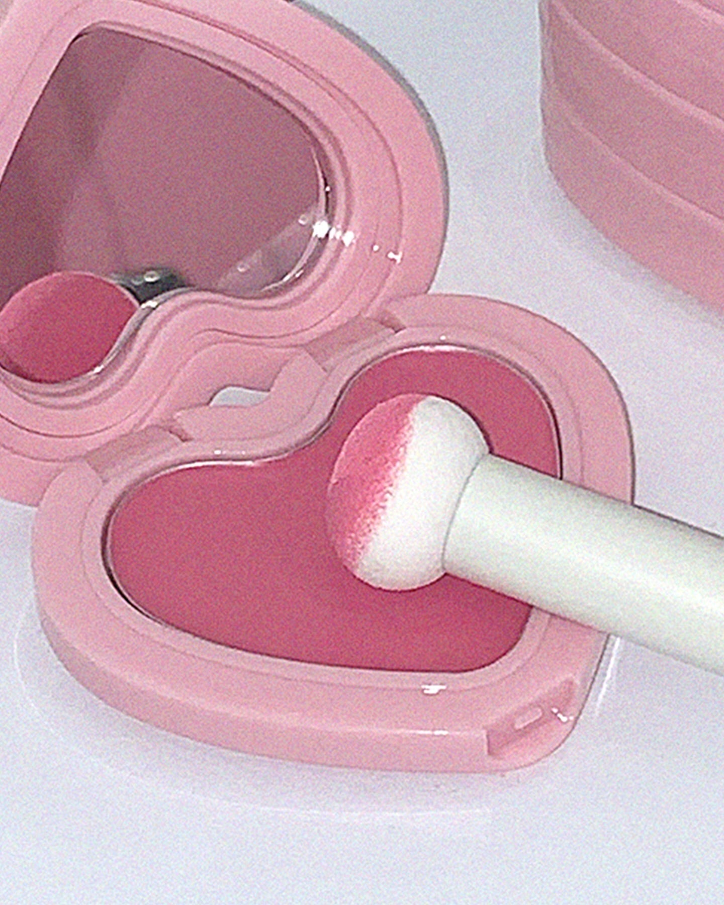 AOU Soft Cream Blush in heart-shaped pink compact with applicator for a natural, soft glow.