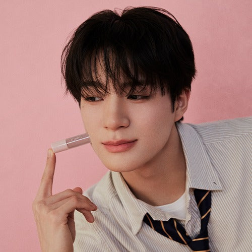 Person holding A'PIEU Juicy Pang Bear Cream Blusher Mini against a pink background